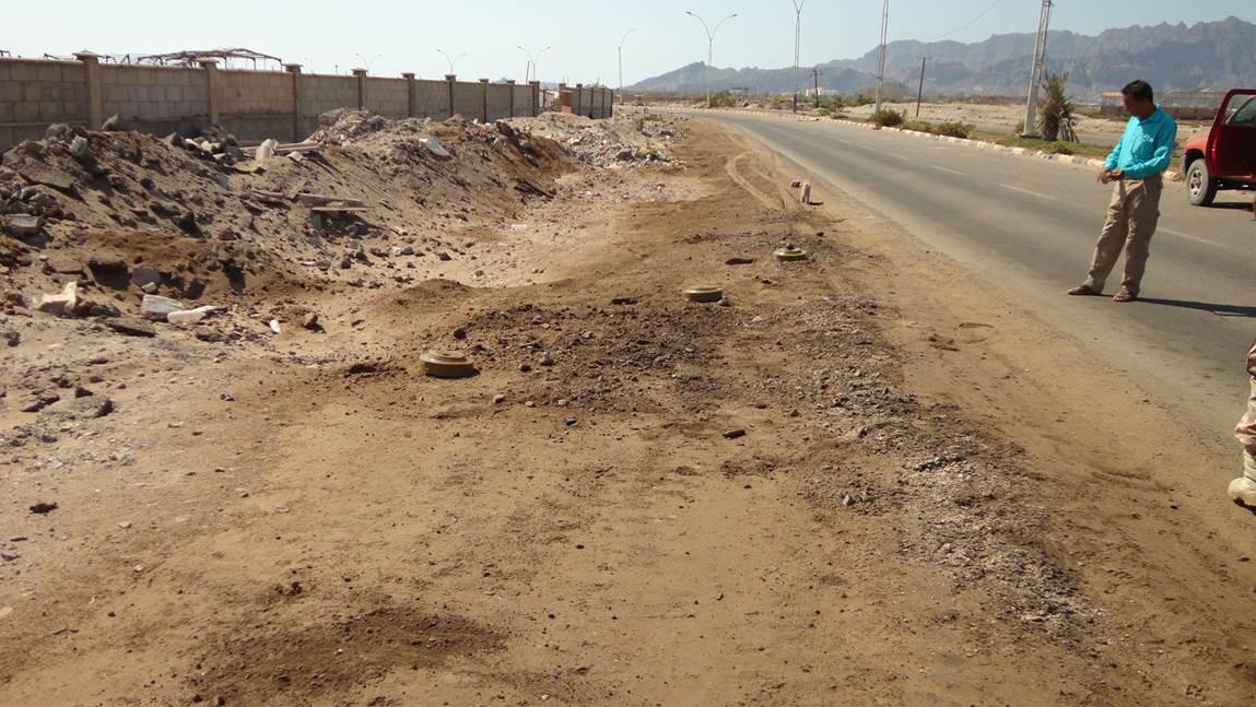 Three antivehicle mines lie at the side of the road from Mansoura district to the Coast Guard HQ and al-Nasr Camp in Khormakser district of the governorate of Aden in October 2015.