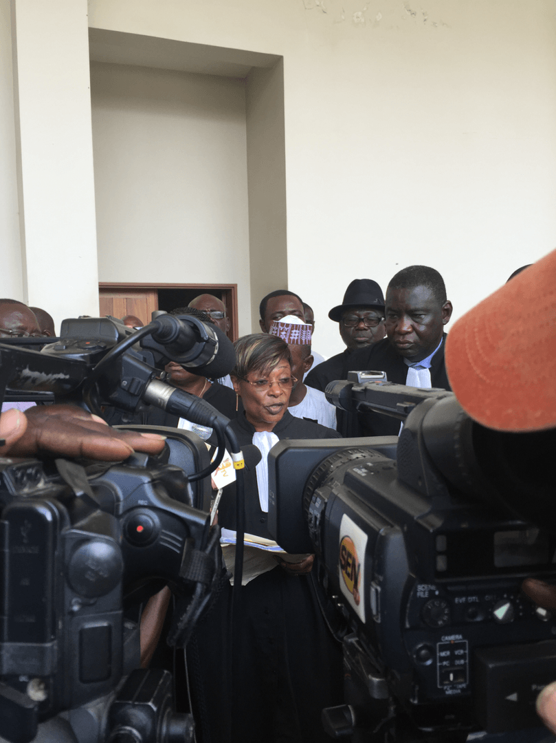 Jacqueline Moudeina speaking to reporters after the reading of the charges