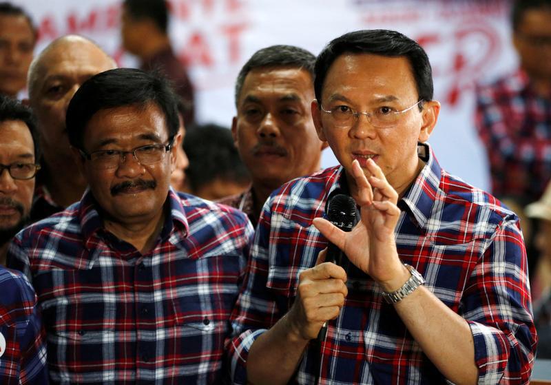 Jakarta Governor Basuki Tjahaja Purnama, nicknamed "Ahok", (R) speaks with the media regarding a blasphemy complaint against him while standing next to deputy governor Djarot Saiful Hidayat in Jakarta, Indonesia November 16, 2016.