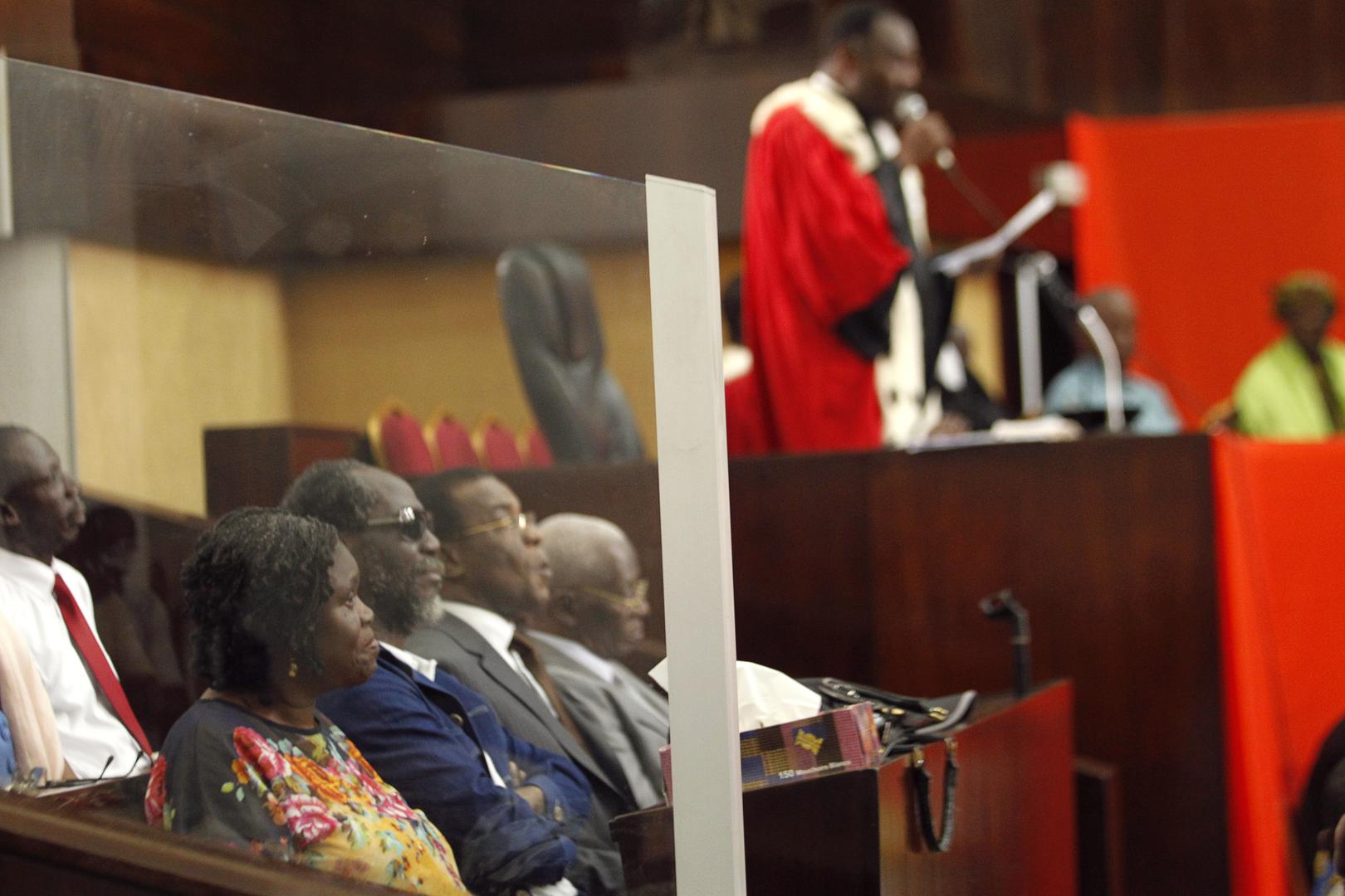 Ivory Coast's former first lady Simone Gbagbo (at left) on December 26, 2014 during the first day of her previous trial for crimes against the state.