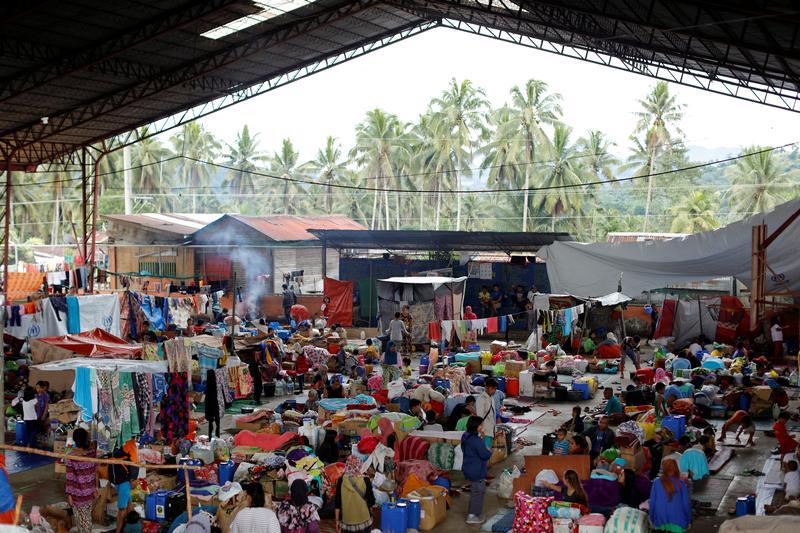 Displaced families stay at an evacuation centre outside the city, as army troops continue their assault against insurgents from the Maute group in Marawi city, Philippines, July 3, 2017.