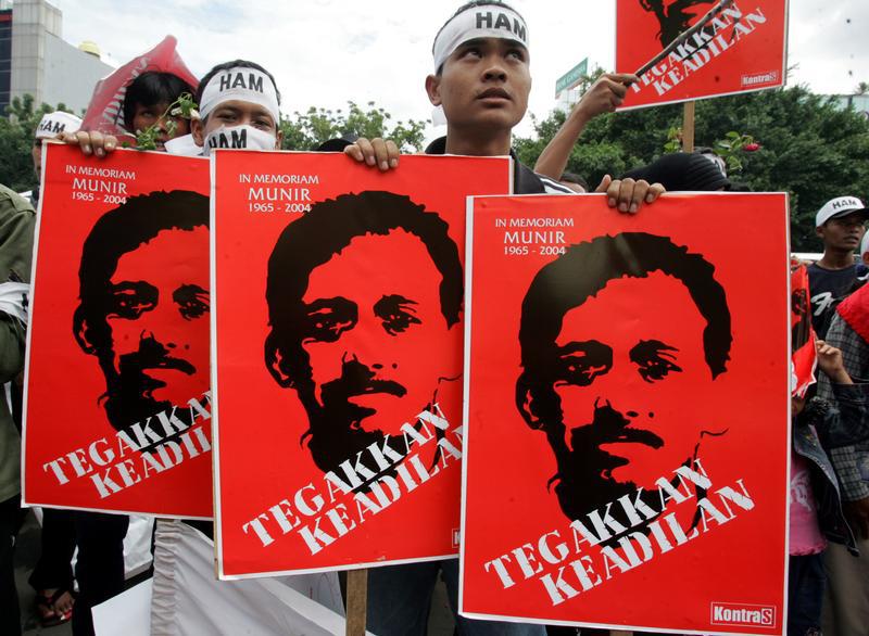 Indonesian protesters hold placards of human rights activists Munir Thalib in Jakarta December 20, 2005.