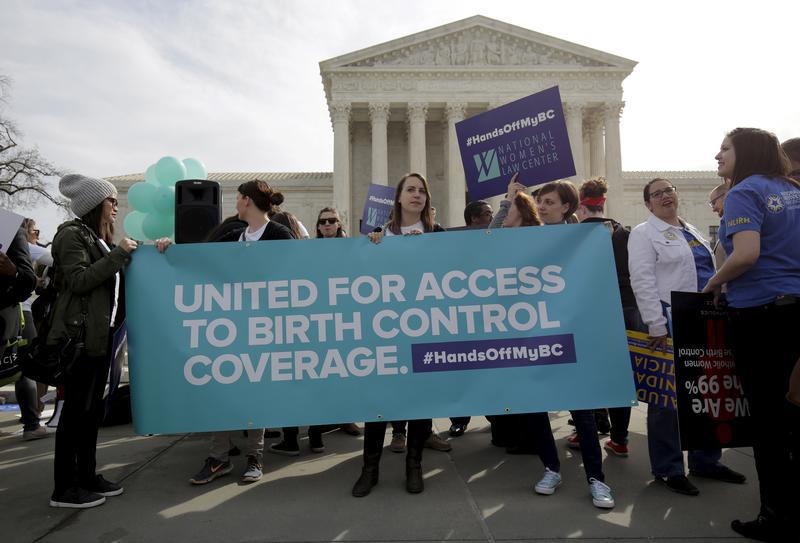 Supporters of contraception rally before Zubik v. Burwell, an appeal brought by Christian groups demanding full exemption from the requirement to provide insurance covering contraception under the Affordable Care Act, is heard by the U.S. Supreme Court in