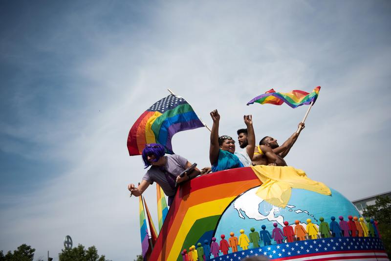 People dance as they participate in the annual Gay Pride parade in Berlin, Germany on July 23, 2016. In Germany, same-sex couples can become registered partners, but cannot get married.