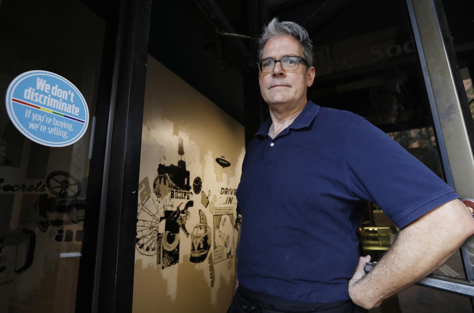 In response to the state’s “license to discriminate” bill, Steve Long displays a sticker welcoming LGBT customers to his restaurant in Jackson, MS, on October 2, 2017. 