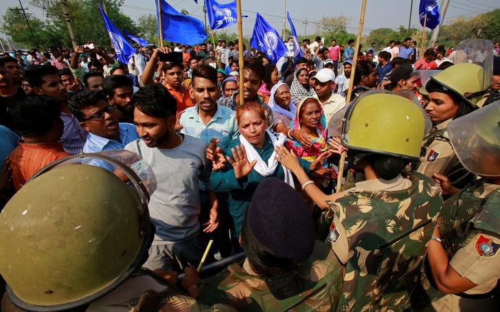 Police try to stop people belonging to the Dalit community as they take part in a protest during a nationwide strike called by Dalit organisations, in Chandigarh, India, April 2, 2018. REUTERS/Ajay Verma