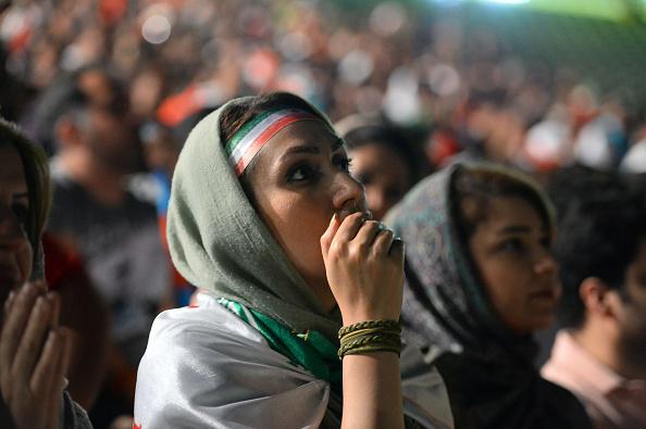 Women watch the 2018 FIFA World Cup match between Iran and Portugal in a public viewing event at Azadi Stadium in Tehran, Iran on June 25, 2018. © 2018 Getty Images