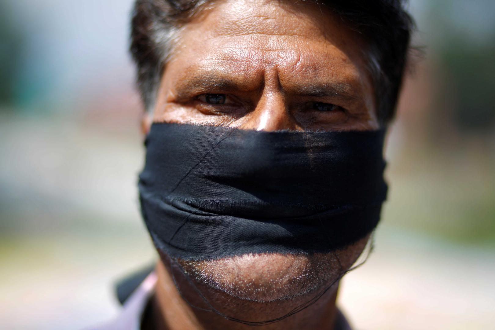 A journalist protests a set of laws that threaten to curb free speech, Kathmandu, Nepal, September 19, 2018.