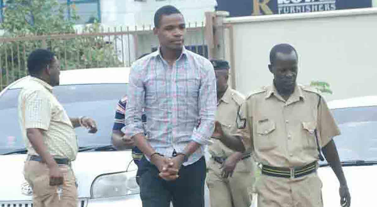 Prison guards escort Bob Chacha Wangwe to the Kisutu Magistrates Court in Dar es Salaam, May 11, 2016.