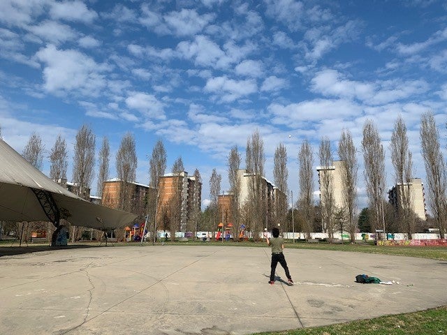 A lone juggler in a deserted park in Milan. Under the restrictions, people are allowed out to exercise by themselves. March 15, 2020.