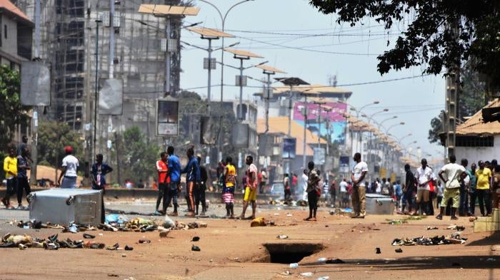 A group of people standing in a city street