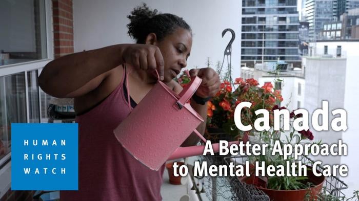 Kaola Baird, a former client of the Gerstein Crisis Centre and a current Gerstein FRESH worker, waters plants on her terrace at her home in Toronto, Canada. 
