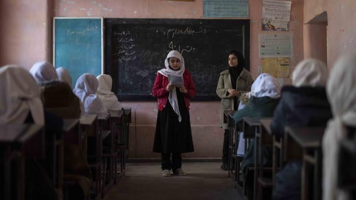 An Afghan girl reads in a classroom at Tajrobawai Girls High School, in Herat, Afghanistan, November 25, 2021.