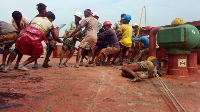 Workers dismantling a ship without adequate protective equipment in Chattogram Bangladesh.