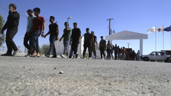 Migrants from Syria walk towards a refugee camp at Kokkinotrimithia, outside of the capital Nicosia, in the eastern Mediterranean island of Cyprus, September 10, 2017. 