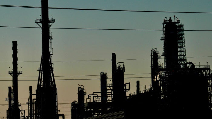 Silhouetted industrial plant