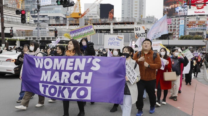 People march in an International Women's Day demonstration