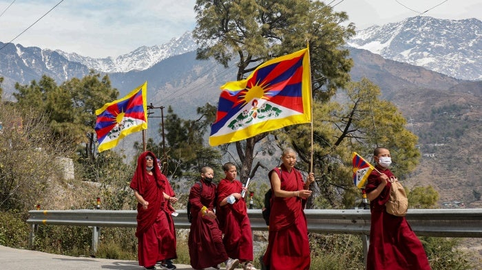 Tibetan monks in exile in India take part in a peace march commemorating the 1959 Tibetan uprising against Chinese rule, near Dharamsala, March 10, 2024.