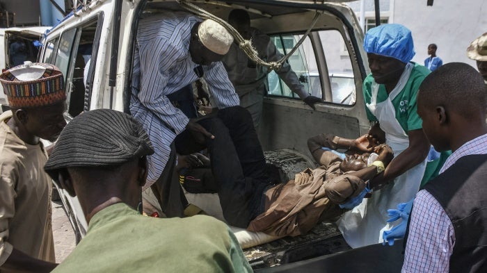 A victim of a recent wave of suicide attacks arrives for treatment at a hospital in Maiduguri on June 29, 2024.