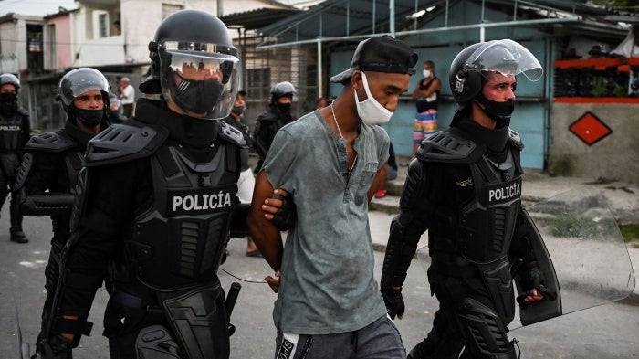 A man is arrested during a demonstration against the government of President Miguel Diaz-Canel in Havana.