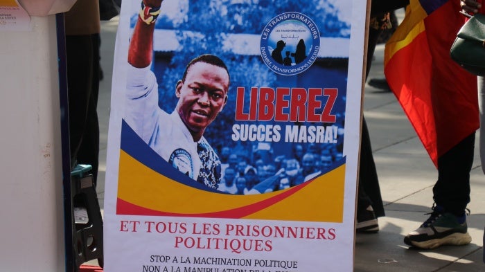 A poster calling for the release of Succes Masra at a protest in Paris.