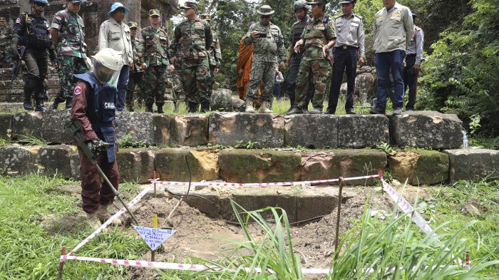 Cambodian military personnel and international observers inspect damage from shelling at Preah Vihear Temple in Preah Vihear province, Cambodia, August 20, 2025.