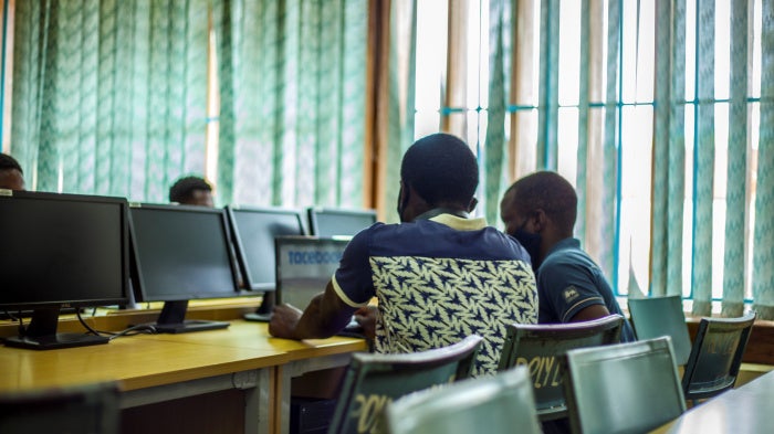 Students following up a lesson through a laptop in Blantyre, Malawi, January 13, 2021.