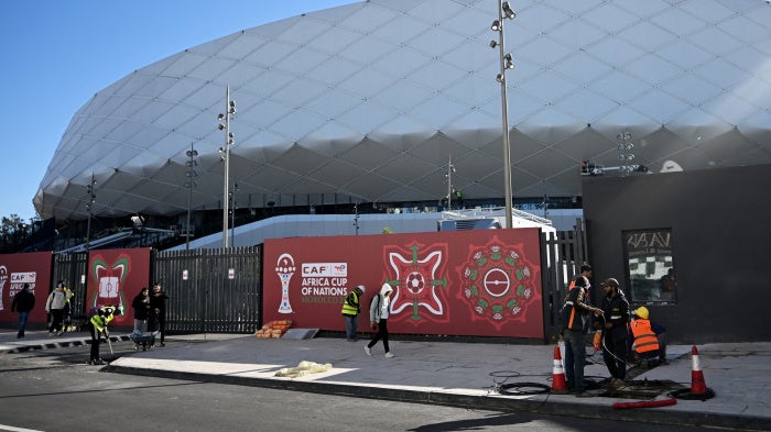 Workers outside of the Al-Medina Stadium in Rabat, on December 18, 2025, ahead of the Africa Cup of Nations (AFCON).
