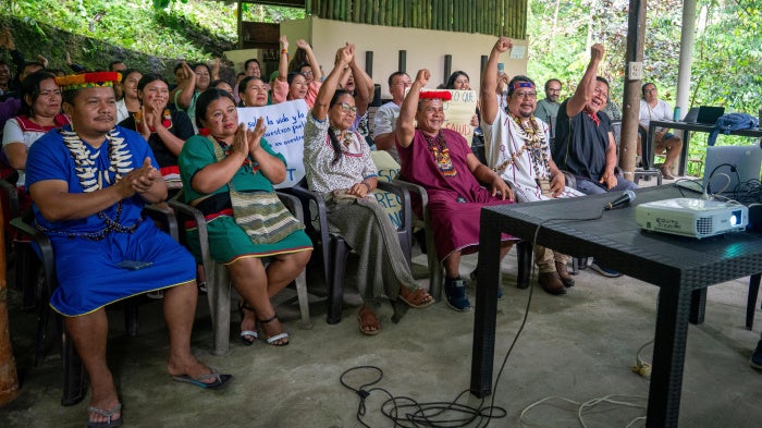 Members of Alianza Ceibo, belonging to the Siekopai, A’i Cofán, Siona, and Waorani Indigenous communities, attend a virtual hearing where a decision was made to unfreeze their organization’s funds. 