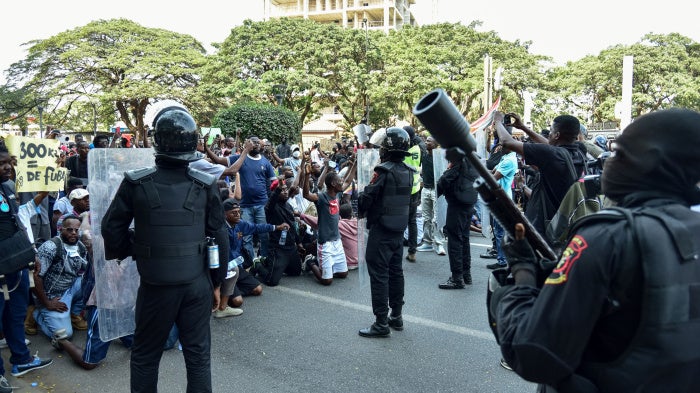 Angola's Rapid Intervention Force faces demonstrators during a protest 