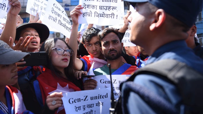 Nepali Gen Z activists hold banners which read "Don't Forget the Blood of Martyrs"