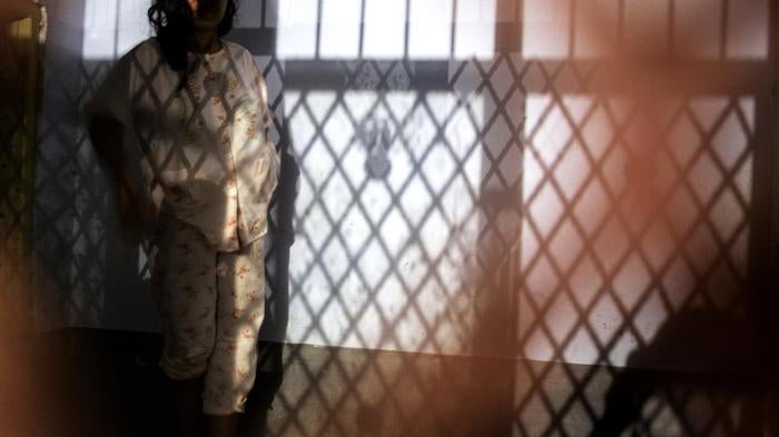 a woman at a healing center in Brebes, Indonesia 