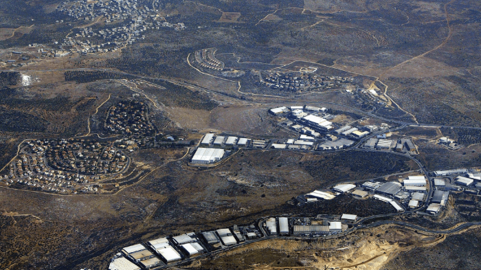 Barkan, located in the occupied West Bank, is an Israeli residential settlement and industrial zone that houses around 120 factories that export around 80 percent of their goods abroad. In the background is the Palestinian village of Qarawat Bani Hassan.