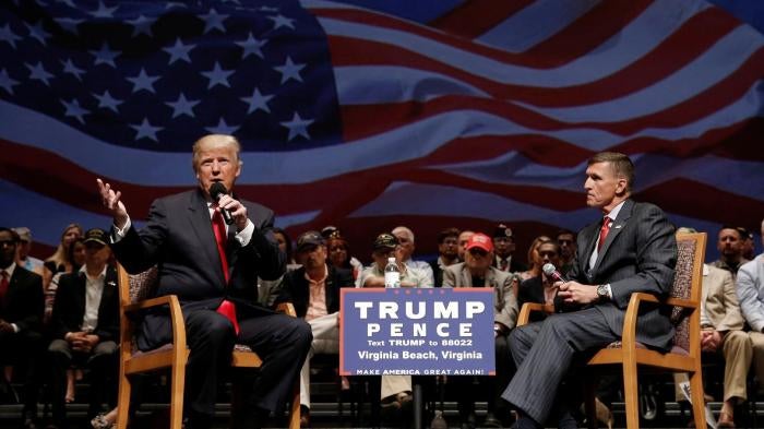Donald Trump speaks alongside retired Lt. Gen. Mike Flynn during a campaign town hall meeting in Virginia, US, on September 6, 2016.