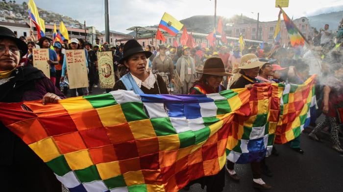 Indigenous people arrive in Quito after marching for 10 days to protest new mining and water law initiatives, as well as a constitutional reform project that would have allowed for indefinite re-election of the president. 