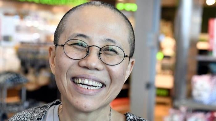 Liu Xia, the widow of Chinese Nobel Peace Prize-winning political dissident Liu Xiaobo, smiles as she arrives at the Helsinki International Airport in Vantaa, Finland, July 10, 2018. Lehtikuva/Jussi Nukari via REUTERS 