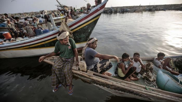 Fishermen rest on their boats in Hodeida, Yemen before going out to sea, September 2018. Since 2018, Saudi-led coalition naval forces have attacked fishing boats in the Red Sea, killing at least 47 Yemeni fishermen. © 2018 Hani Mohammed/AP Photo