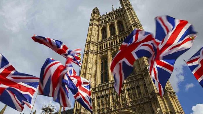 Union Jack flags fluttering outside Houses of Parliament in Westminster, London, October 1, 2019.