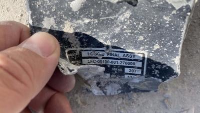 A remnant with a data plate containing alpha-numeric codes