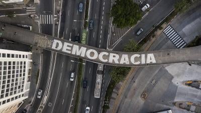 The word “democracy” on a pedestrian bridge in São Paulo, Brazil, October 26, 2022.