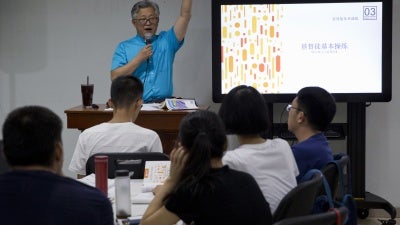 Jin Minri leads a class on the basics of Christian beliefs at the Zion Church in Beijing, China, August 4, 2018. 
