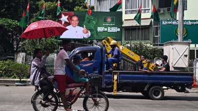 A billboard of the chairman of the Myanmar military-backed Union Solidarity and Development Party ahead of the start of the campaign period for the junta’s elections in Yangon, October 27, 2025. 