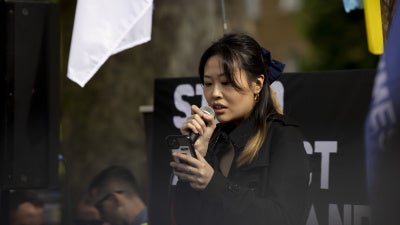 Carmen Lau, a Hong Kong pro-democracy activist in exile, speaking during a rally at Downing Street, London, June 4, 2022.