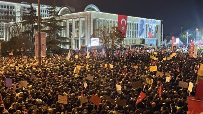 People gather outside the Istanbul municipality building in Istanbul, Türkiye, to protest the arrest of mayor Ekrem İmamoğlu, March 22, 2025. 