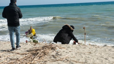 Relatives of a person who went missing after a migrant boat sank on February 26 on the beach near where the shipwreck took place off the coast of Steccato di Cutro, near Crotone, in Calabria in southern Italy. March 7, 2023. 