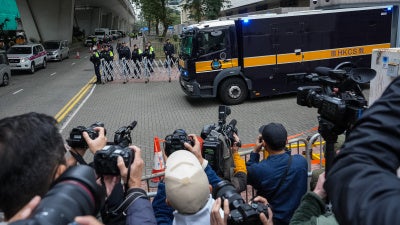 A correctional services department vehicle believed to be carrying Hong Kong publisher and activist Jimmy Lai leaves the West Kowloon Magistrates' Courts following Lai's sentencing, Hong Kong, February 9, 2026. 