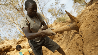 A picture of a child working in a gold mine.