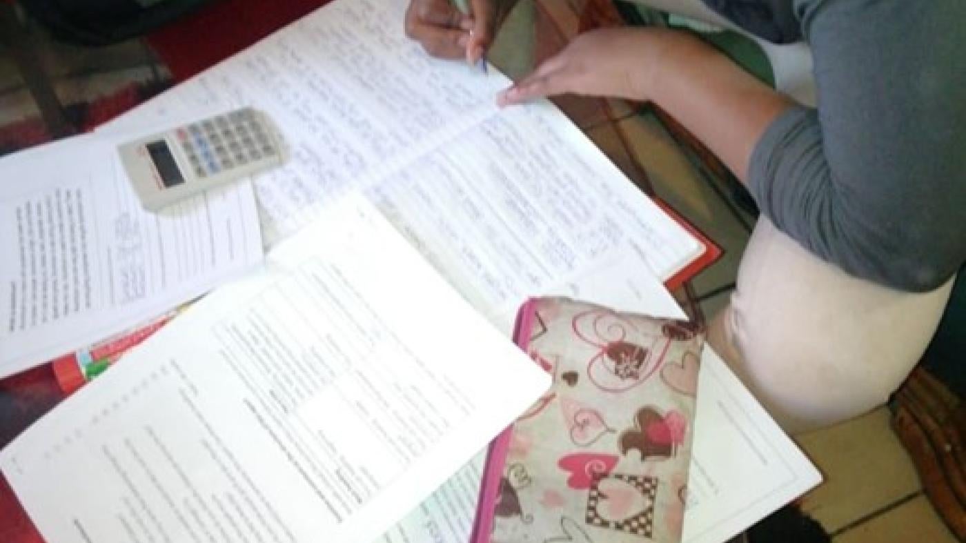 Keshia completes her homework in her family’s home in Johannesburg in August 2020. ©2020 Private