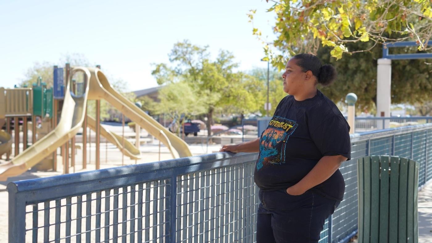 Mother looking at playground