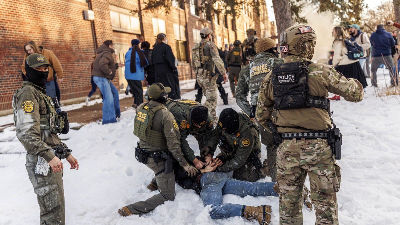 US Border Patrol agents detain a person near Roosevelt High School during dismissal time as federal immigration enforcement actions sparked protests in Minneapolis, Minnesota, on January 7, 2026. 